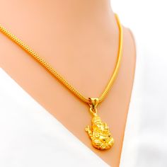 This intricate and graceful pendant is crafted from 22k gold, weighing 4.2 grams, and features a beautifully detailed depiction of Ganesh in a luminous yellow gold finish. The pendant has a length of 1.1 inches, showcasing the artistry and elegance of the design. Ideal for those who seek a blend of spiritual significance and refined beauty, this Ganesh pendant is a testament to sophisticated craftsmanship, offering a touch of divine grace and timeless allure to any jewelry collection. PRODUCT DE Ganesh Pendant, Bridal Jewelry Necklace, Precious Stones Rings, Diamond Pendant Sets, Divine Grace, Modern Bracelets, Fancy Necklace, Fancy Rings, Mens Gold Rings