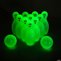 glow green bowling balls with holes in them