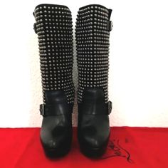 This Is An Authentic Pair Of Christian Louboutin Calfskin Vip Leather Marisa 140 Studded Boots Size 38 In Black. These Stylish Boots Have A Platform Toe And A 5.25 Inch Stacked Heel. Crafted Of Polished Leather, The Shaft Is Embellished With Brilliant Silver Tone Studs And Accented With Leather Straps And Buckles. These Are Calf Height And Feature The Iconic Red Lacquered Soles. Platform For Extreme Comfort Good Condition 7/10 Due To Normal Wear Handbags Not Included Listed For Style Only Size Eu 38 Made In Italy Glamorous Studded Leather Boots, Designer Round Toe Platform Boots For Party, Party Boots With Studs In Calf Leather, Leather Boots With Spikes For Evening, Designer High Heel Platform Boots For Party, Luxury Studded Boots For Party, Luxury Black Spiked Boots, Luxury Studded Party Boots, Luxury Studded Boots