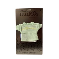 a green shirt that is in the packaging for a baby's clothing line, which includes