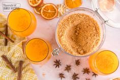 an overhead view of orange juice and spices