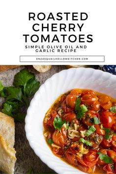 roasted cherry tomatoes with garlic and garlic in a white bowl next to bread on the side