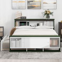 a bed with white sheets and green trim on it in a room that has striped walls