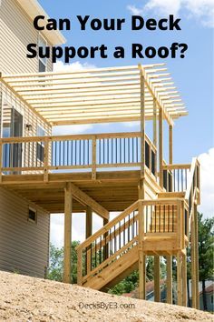 a wooden deck with stairs and railings in front of a house that says can your deck support a roof?