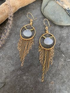 Fun boho style fringe earrings ... crafted with hand forged gold tone hoops with hand wire wrapped dainty gold tone chain accented with elegant Moonstone focal gemstones . These beauties measure 4 inches in length . Gold Bohemian Chandelier Earrings With Dangling Beads, Bohemian 14k Gold Filled Wire Wrapped Jewelry, Handmade Gold Bohemian Tassel Earrings, Bohemian Dangle Hoop Earrings In 14k Gold Filled, Bohemian 14k Gold Filled Dangle Hoop Earrings, Wire Wrapped Brass Chandelier Dangle Earrings, Gold Bohemian Long Drop Jewelry, Bohemian Dangle Fringe Hoop Earrings, Bohemian Wire Wrapped Dangle Hoop Earrings