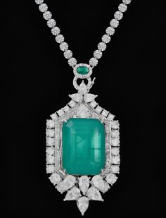 Colombian fusion Emerald-inspired statement necklace is truly exquisite! The large 3/4" x 1" Emerald Center with visible veins, identical to a genuine Colombian Emerald, makes stunning centerpiece. The option to wear it with either Emerald stations or a plain chain, thanks to the two enhancers included, offers versatility and style. Necklace measures: 26" Elegant Emerald Necklace With Large Pendant, Exquisite Formal Necklace With Large Pendant, Formal Green Jewelry With Large Pendant, Green Large Pendant Jewelry For Formal Events, Unique Formal Necklace With Detachable Pendant, Unique Necklace With Detachable Pendant For Formal Events, Unique Formal Necklaces With Detachable Pendant, Unique Necklaces With Detachable Pendant For Formal Events, Visible Veins