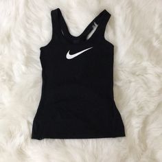 Very Comfortable Nike Sports Tank. Size Xs. Nwot. Never Worn. New Condition. It Makes Body Look Slim When Wear On. Sporty Tank Top With Logo Print For Streetwear, Sporty Streetwear Tank Top With Logo Print, Black Logo Print Tank Top For Streetwear, Black Go-dry Tank Top For Sports Season, Black Sporty Moisture-wicking Tank Top, Sporty Black Moisture-wicking Tank Top, Black Sporty Tops For Workout, Sporty Black Tops For Workout, Casual Black Tops With Go-dry