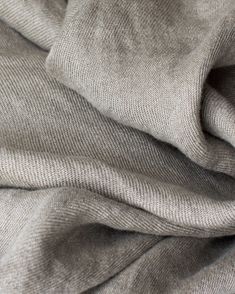 a close up view of a gray fabric