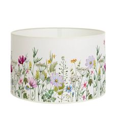 a lamp shade with flowers painted on it