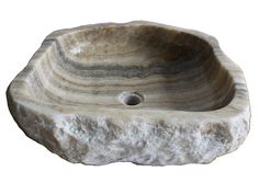 a stone sink that is shaped like a rock