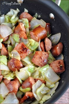 sausage, cabbage and onions are mixed together in a bowl for an easy dinner or side dish