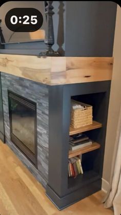 a living room with a fire place and bookshelf