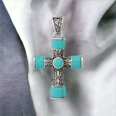 925 Sterling Silver Large Chunky Synthetic Turquoise Antiqued Cross Pendant Metal: Sterling Silver Purity: 925 Stone: Synthetic Turquoise Weight: 5.8 Grams Size: 35.45mm X 28.21mm Hollow, Casted, Concave, Imported Mcqgqc8145 Bohemian Blue Cross Jewelry, Silver Turquoise Necklace Stamped 925, Southwestern Blue Cross Jewelry, Southwestern Style Blue Cross Jewelry, Bohemian Turquoise Necklace Stamped 925, Bohemian Blue Turquoise Necklace Stamped 925, Handmade Silver Cross Turquoise Necklace, Elegant Turquoise Cross Jewelry, Turquoise Sterling Silver Cross Pendant