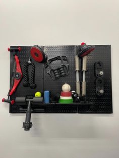 there is a pegboard with tools on it that are organized in the shape of a board