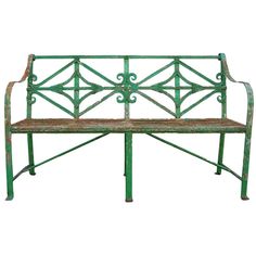 a green metal bench sitting on top of a white background