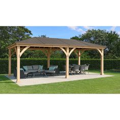 a wooden gazebo sitting on top of a lush green field