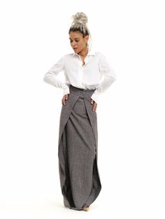 "Subvert expectations in our unique maxi skirt. The high-waisted design defines your waist while the diagonal layered fabric elongates your body. FEATURES: A floor-length pinstripe maxi skirt. High-waisted design with a zipper at the back. Please note that this piece does not have pockets. 100% Handmade. SIZE & FIT: Fit: A relaxed fit with room to move The model is wearing size Small or S/M View our SIZE CHART before ordering MATERIALS & CARE: Content: Linen Care: Machine wash on cold (30ºC) wit Long Linen Skirt, Maxi Skirt Outfit, Skirt With Split, Cotton Maxi Skirt, Linen Layers, Classic White Shirt, Rock Outfit, High Waisted Maxi Skirt, Maxi Skirt Outfits