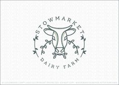 a logo for a dairy farm with an image of a cow's head in the center