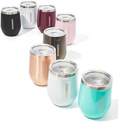 several different colored cans are lined up in a row