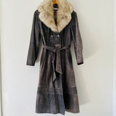 Vintage 1970's Cosa Nova Gray Suede Penny Lane Long Lined Jacket Coat with Fox Fur Collar Trim Size 12 Made in Canada Such a lovely and soft coat, perfect for fall and staying warm. Please view pictures as part of the description. All vintage items are final sale. Please visit my other vintage collectibles in my shop : https://www.etsy.com/ca/shop/Sewfunky?ref=shop_sugg§ion_id=31004548 Vintage Brown Long Sleeve Outerwear For Winter, Vintage Winter Outerwear With Long Sleeves, Vintage Brown Long Sleeve Outerwear For Fall, Vintage Winter Outerwear With Buttons, Retro Fall Outerwear For Vintage Fashion, Fitted Vintage Brown Outerwear For Winter, Vintage Outerwear For Fall, Fitted Winter Outerwear For Vintage Fashion, Vintage Fitted Winter Outerwear