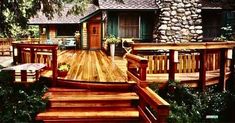 a wooden deck in front of a house