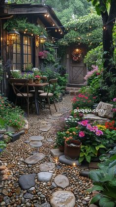 an outdoor dining area with tables and chairs surrounded by plants, rocks and flowers in the foreground