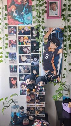 there are many anime pictures on the wall