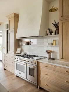 a kitchen with an oven, stove and counter tops in it's center island