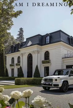 a white jeep parked in front of a large house