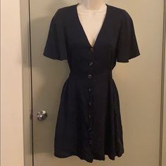 Adorable Flowy Zara Dress With Cinched Waist, V-Neck, Ruffled Sleeves And Front Buttoned Closure. Flattering Fit. Elastic Waistband Makes For A Flexible Comfortable Fit. It Looks To Be A Very Dark Navy Color (Posted The Green Version As It Was The Color Shown On The Model). Never Worn (As I Realized I Have A Very Similar Dress Already). Casual V-neck Short Sleeve Dress For Date Night, Casual V-neck Lined Mini Dress, V-neck Lined Mini Dress For Day Out, Rayon V-neck Sundress Mini Dress, Casual Lined Midi Dress By Zara, V-neck Lined Midi Dress For Dress Down Occasions, V-neck Mini Dress In Rayon, V-neck Rayon Mini Dress, V-neck Rayon Mini Dress For Date Night