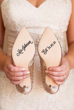 a bride holding her wedding shoes with the words i every step off the way