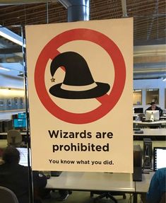 a sign that says wizards are prohibited you know what you did in the office area