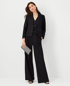 Elevate your wardrobe with the Ann Taylor Pleated Wide-Leg Pant in Linen Twill, a blend of sophistication and comfort. These pants are designed to flatter with a high-rise waist and a flowing wide-leg silhouette that adds a touch of modern elegance to any outfit.  - **Size:** 12 Regular - **Color:** Black - **Material:** 54% Linen, 29% Polyester, 15% Viscose, 2% Spandex - **Gender:** Female - **Fit:** Relaxed and easy - **Length:** Full length, 32" inseam with a 26 1/2" leg opening - **Features: Professional Suits For Women, One Button Blazer, Knitted Suit, Twill Pants, Wide Leg Pant, Suit Separates