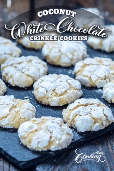 coconut white chocolate crinkle cookies on a black tray