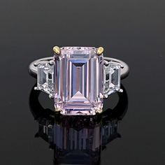 This modern LAVISH designer Pink Topaz ring is made with emerald cut pink Topaz with clear topaz side gemstones. The perfect Christmas gift for your partner or mum. 💎 Main Gemstone: Natural Pink Topaz 10*14mm 💎 Main Gemstone Shape: baguette 💎 Side Gemstones: Clear Topaz 💎 Material: Sterling Silver with rhodium finish. 💎 Band Size - please message us with your correct ring size. If you require any size that is not listed please send me a message. ✨ For free giveaways, special offers and late Dazzling Pink Emerald Cut Ring, Elegant Pink Three Stone Rings, Pink Brilliant Cut Amethyst Wedding Ring, Wedding Pink Brilliant Cut Amethyst Ring, Pink Sapphire Ring With Emerald Cut And Accent Stones, Elegant Pink Emerald-cut Sapphire Ring, Elegant Pink Emerald Cut Sapphire Ring, Pink Rectangular Stone Ring For Anniversary, Pink Sapphire Ring Emerald Cut For Formal Occasions