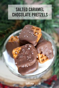 salted caramel chocolate pretzels on a plate with pine branches in the background