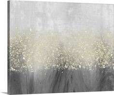 an abstract painting with white flowers on grey and gold paint, in the background is a gray