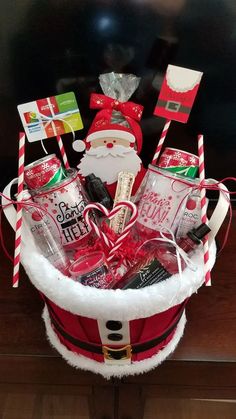 a christmas gift basket with santa clause hat and candy canes