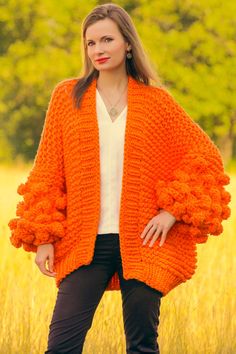 "----------READY TO SHIP by SuperTanya---------- Brand: SuperTanya; Style: hand knitted cardigan; Material: premium class soft baby yarn; Color: Orange Design: Chunky style Size & Measurements of the cardigan: Body length, measured from the shoulder top to the bottom end: 26\" / 66 cm; Chest width, measured at the back, between the underarms: 26\" / 66 cm; Sleeve length, measured from the underarm to the end of the cuff: 15.7\" / 40 cm *All measurements are taken with the item laid flat and not