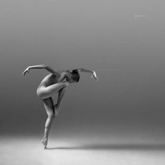 a black and white photo of a ballerina