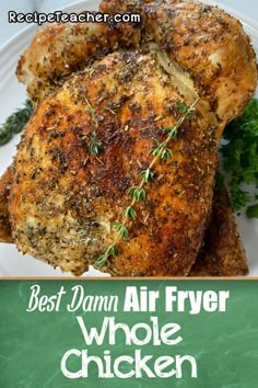 the best damn air fryer whole chicken recipe on a white plate with green herbs