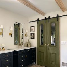 a bathroom with double doors and two sinks