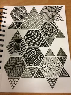 a notebook with black and white designs on it