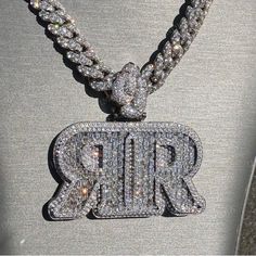 Custom "RR" Letter Pendant, Real Moissanite, Custom Hip Hop Pendant, Iced Out Pendant, Men's Charm Pendant Necklace, Custom Bail, 925 Silver Item Details: Pendant Size: 2.00 Inch Height & 2.75 Inch Width Metal: 925 Sterling Silver Stone: GRA Certified Moissanites OR AAAAA Cubic Zirconia (CZ) Stone Quality: VVS1 D Color Pristine White Pendant Passes Diamond Tester Description: Our custom iced out pendant are meticulously crafted from premium 925 sterling silver. At IMJ India, we take pride in offering unparalleled quality and craftsmanship, ensuring each piece is a true work of art. Key Features: 1. Premium Stone Options: Choose from two exceptional stone qualities:    - AAAAA+ Highest Quality Cubic Zirconia: Radiate brilliance and sophistication with our premium cubic zirconia stones, care Name Pendant, Moissanite Jewelry, Charm Pendant Necklace, Custom Letters, Custom Name Necklace