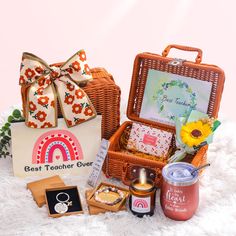 an assortment of gifts in a wicker basket on top of a white furnishing