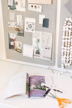 an open book sitting on top of a white desk