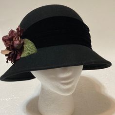 New Hat Is In Excellent Condition Never Worn. Black Velvet Head Band With Pretty Floral Embellishment. 22” Inner Circumference. Classic Black Adjustable Cloche Hat, Black Cloche Hat With Flat Brim, Vintage Black Felt Hat For Fall, Black Vintage Felt Hat For Fall, Black Cloche Felt Hat For Fall, Vintage Black Hat For Fall, Black Felt Hat With Short Brim, One Size, Black Brimmed Mini Hat For Fall, Black Mini Hat With Short Brim For Fall