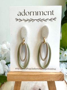 Oval polymer clay dangle earrings in muted shades of off white, tan and sage green. Posts are hypoallergenic 304 surgical stainless steel. This item is handmade and may vary slightly in appearance. Handmade Minimalist Beige Jewelry, Beige Dangle Jewelry For Everyday, Minimalist Handmade Beige Jewelry, Beige Dangle Earrings For Everyday, Everyday Beige Dangle Jewelry, Earthy Beige Jewelry For Everyday Wear, Earthy Everyday Beige Jewelry, Bohemian Dangle Clay Jewelry, Elegant Green Polymer Clay Jewelry