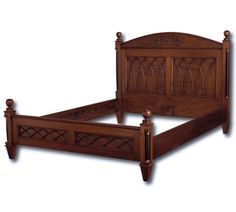 a wooden bed frame with intricate carvings on the headboard and foot board is shown