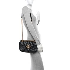 This is an authentic GUCCI Calfskin Matelasse Mini GG Marmont Shoulder Bag in Black. This shoulder bag is made of soft calfskin leather in black. This handbag features aged gold chain shoulder straps, aged gold hardware, a Gucci GG logo closure and a stitched heart on the back. The top opens to a beige microfiber interior with a patch pocket. Gucci Marmont Bag, Gucci Crossbody Bag, Gucci Crossbody, Small Messenger Bag, Gucci Monogram, Vintage Monogram, Gg Logo, Gucci Shoulder Bag, Gg Marmont